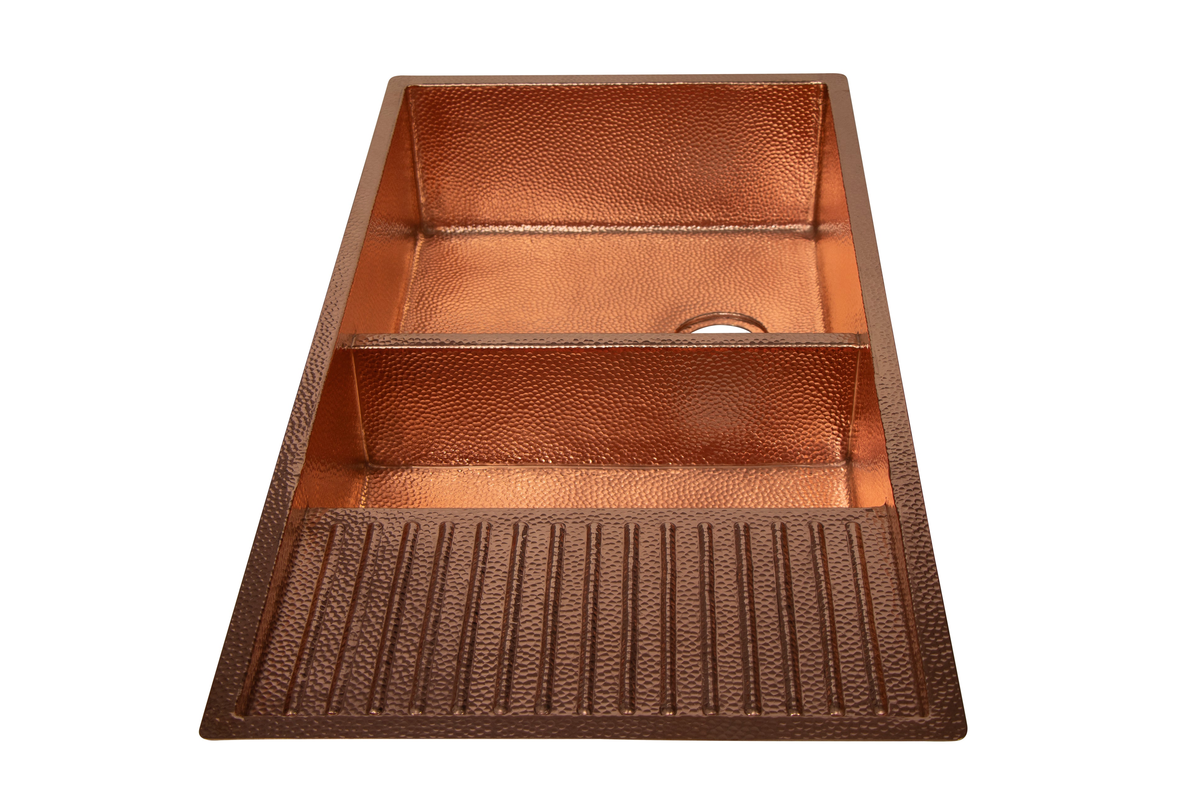 Copper kitchen sink with textured surface on a white background