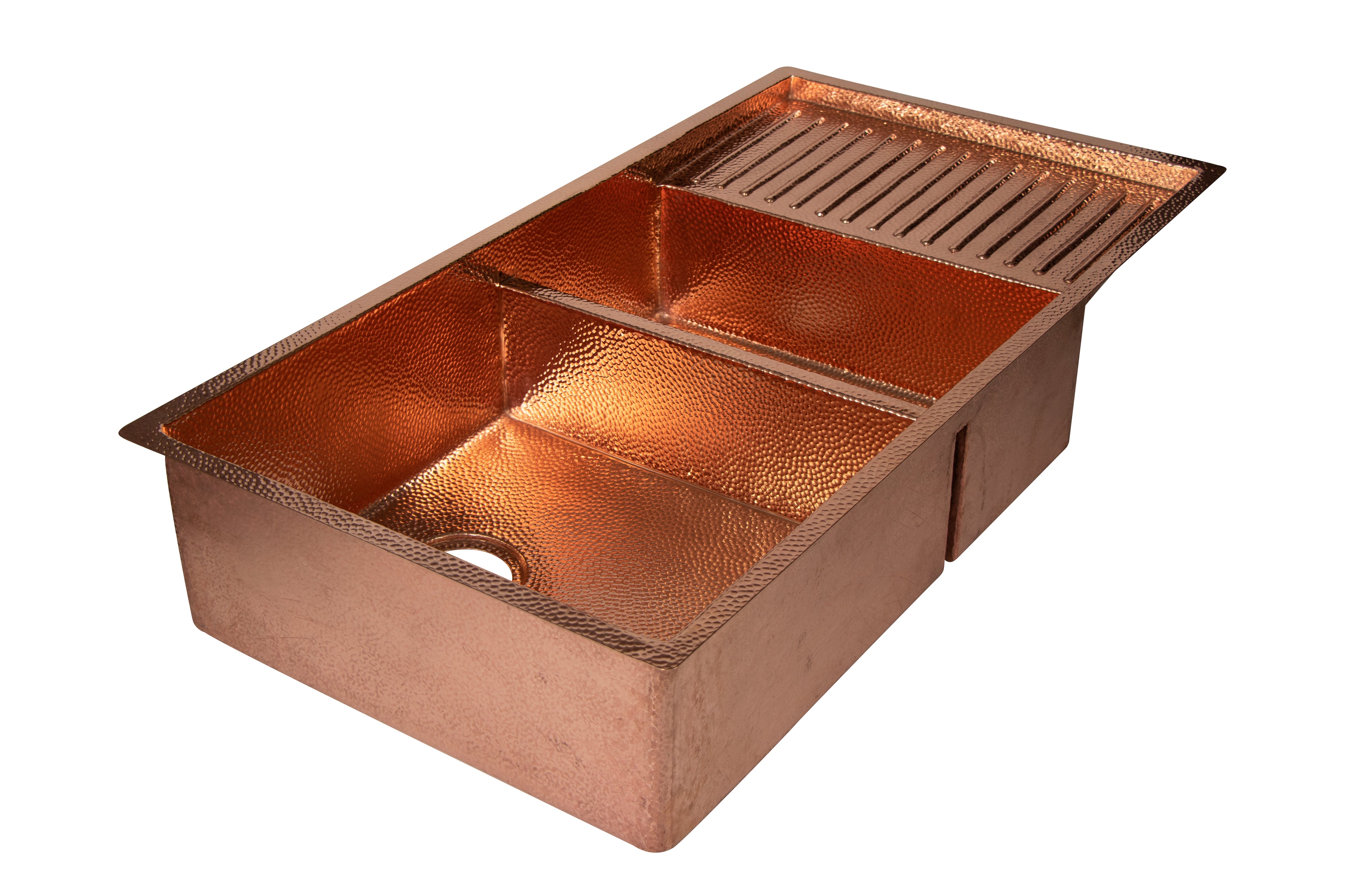 Copper kitchen sink with a textured finish on a white background